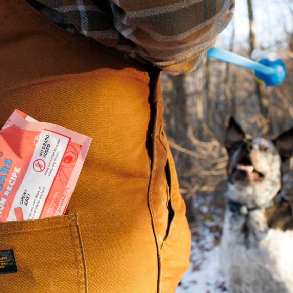 Joining Ottis on a hike, Sam comes prepared with treats and Ottis's favorite ball thrower.